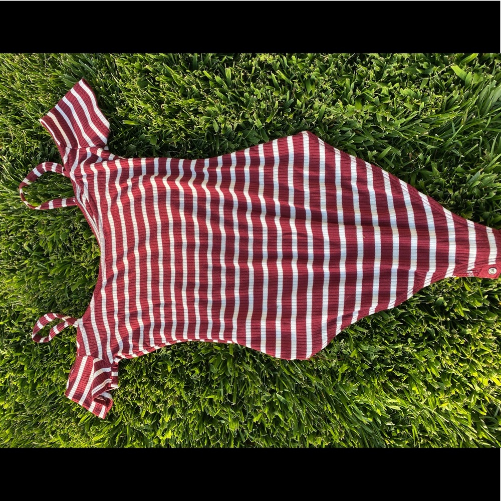 A striped burgundy and white body suit.